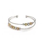Women's Beaded Cuff Bangle with gold, silver, and rose-toned metal beads on a double-band cuff.